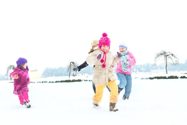 istock Cute family having fun in the snow 1072402162