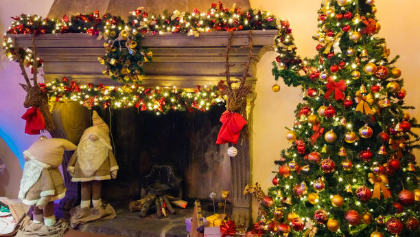istock Living room home interior with decorated fireplace and christmas tree 1072404294