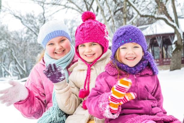 istock Cute family having fun in the snow 1072404472