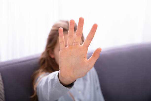 istock Girl Showing Stop Sign 1072406970