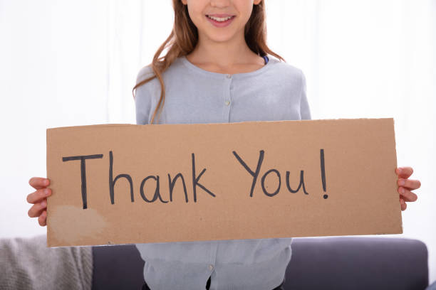 istock Girl Holding Cardboard With Thank You Text 1072406978