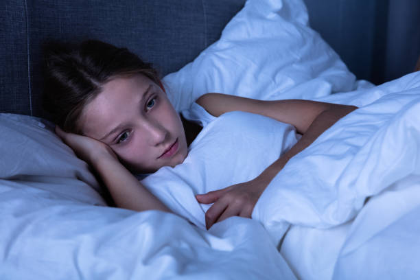 istock Girl Lying On Bed 1072407250