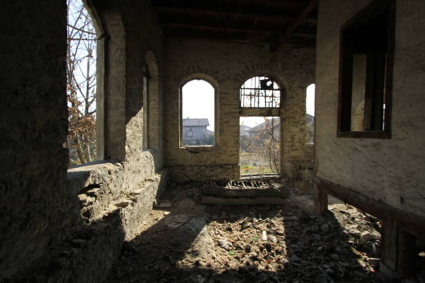 istock An old dilapidated room with open windows and sunlight 1072408954