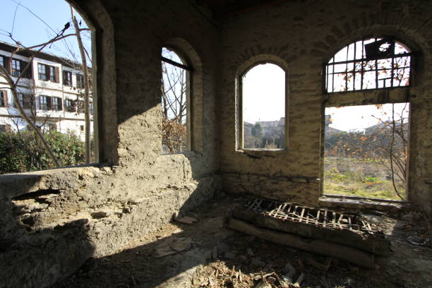 istock An old dilapidated room with open windows and sunlight 1072408998