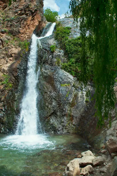 Vertical perspective of one of the several waterfalls in Ourika Valley, close to Setti Fatma village in Southern Atlas Mountains, an excursion popular among the tourists visiting Marrakech, Morocco