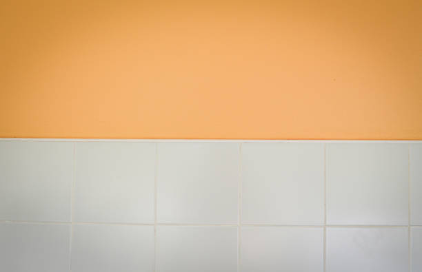 half wall or floor background and white tile seramic texture half wall or floor background / orange brown empty wall and white tile seramic texture background seramic stock pictures, royalty-free photos & images