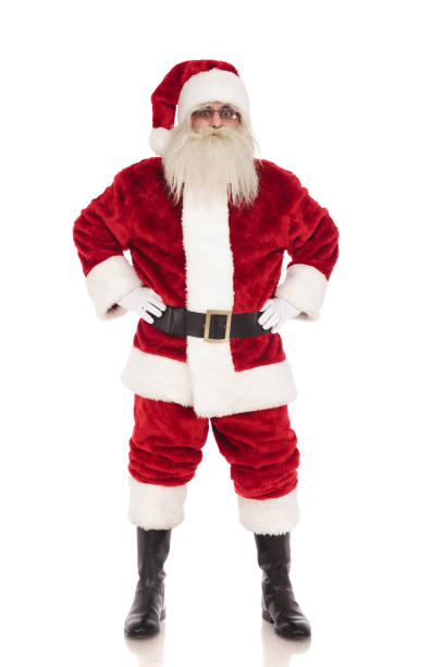 istock merry santa claus stands while holding his hips 1072411306
