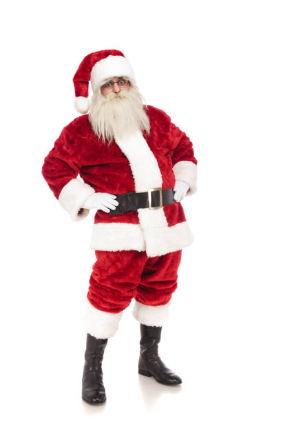 istock funny santa claus holds hips and leans back while standing 1072412966