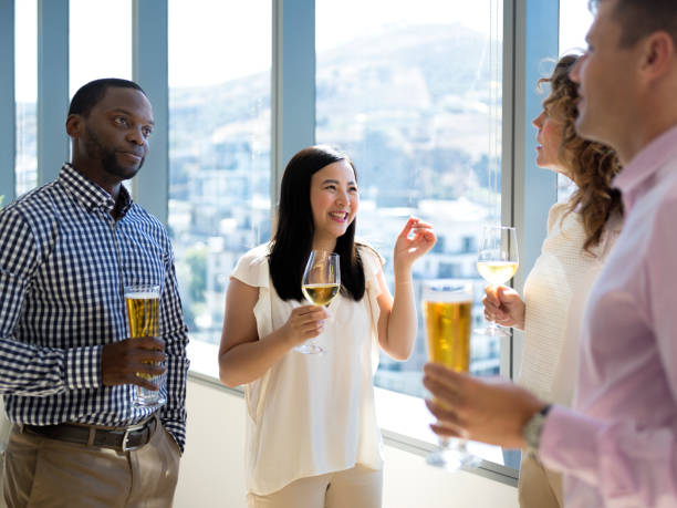 istock Happy business people enjoying drinks after conference. 1072422746