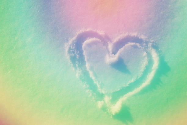 istock heart drawing in fresh white snow. winter 1072423196