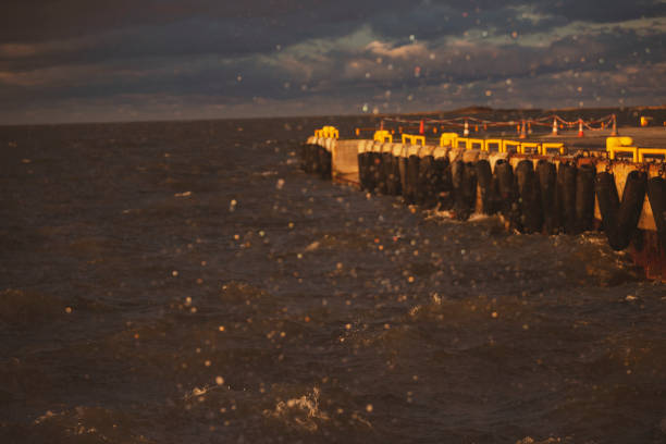 istock Pier in the sea in a storm 1072425118
