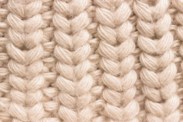 istock Close-up of knitted wool sweater. grey colour 1072425402