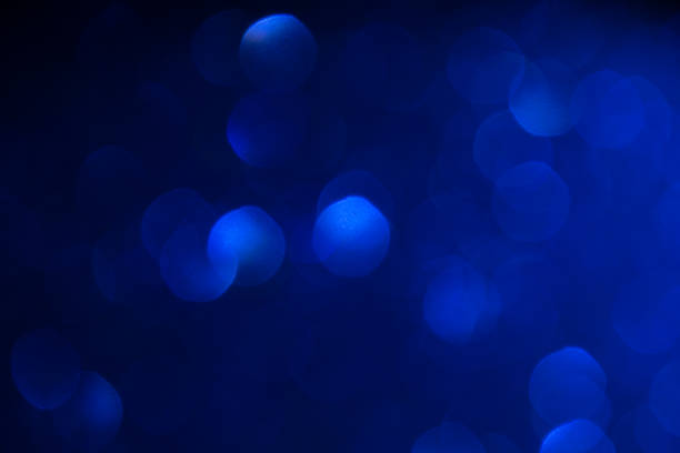 istock blue shiny bokeh background. festival celebration background concept. 1072426326