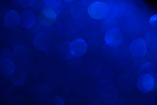 istock blue shiny bokeh background. festival celebration background concept. 1072427504