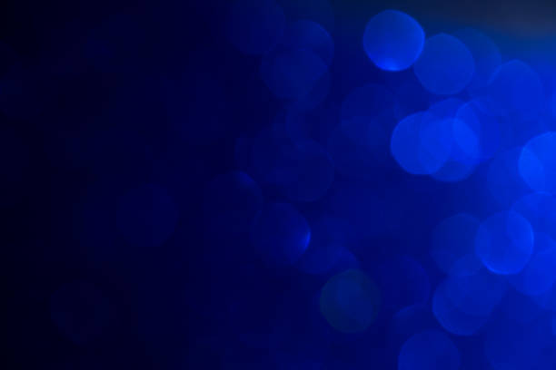 istock blue shiny bokeh background. festival celebration background concept. 1072427654
