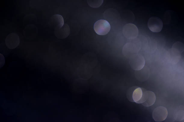istock black spotlight and bokeh background. 1072427920