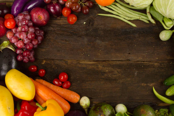 istock Vegetable and fruit frame on dark wooden plank 1072432798