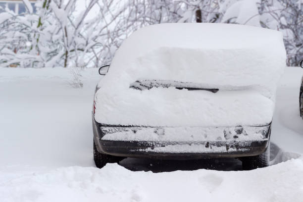 istock Back of the car covered with snow during a snowstorm 1072441422