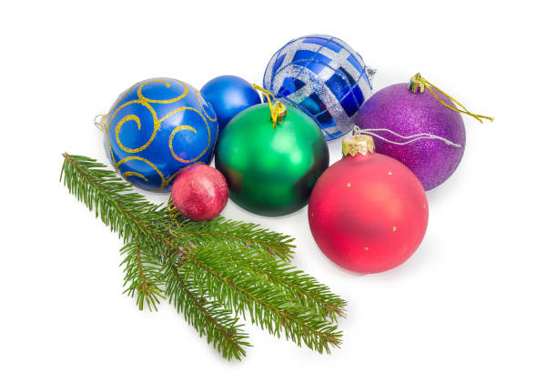 istock Living spruce branch and various Christmas decorations on white background 1072455556