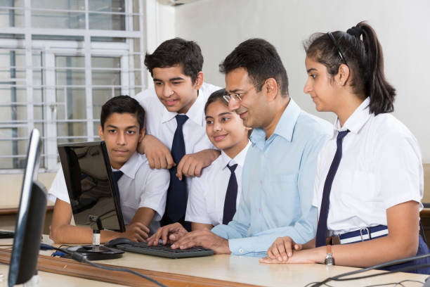 students learning computer programming - stock image - teacher computer high school student classroom imagens e fotografias de stock