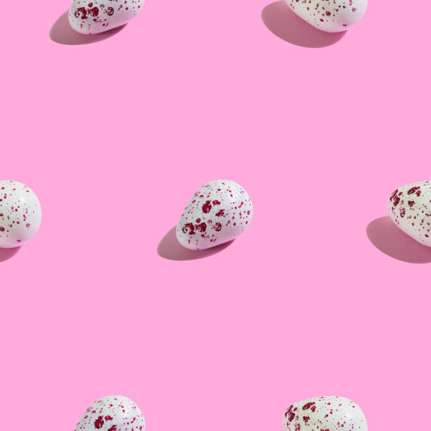 Creative seamless pattern with easter quail eggs on pink background. Sweet abstract background