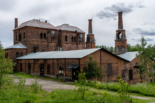 Old brick building with blast furnace from an old closed down steel mill or ironworks in Sweden