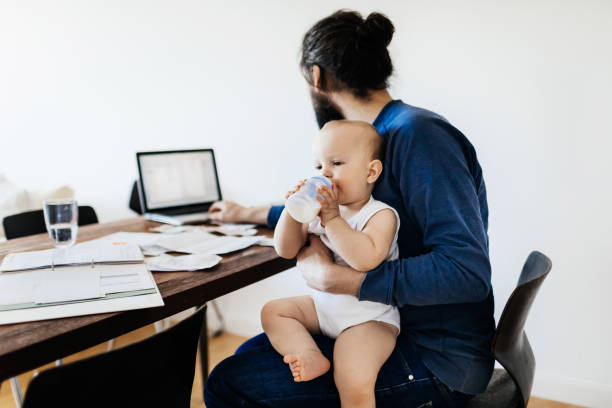 istock Single Dad Working From Home With Baby 1072470440