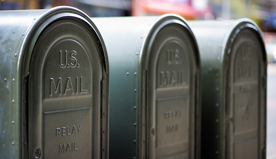 Row of outdoors mailboxes in NY, USA