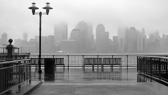 Black and white photo of New York City skyline on a rainy day