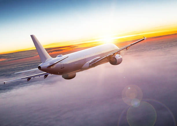 istock Commercial airplane flying above dramatic clouds. 1072472054