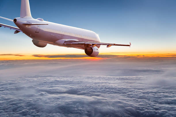 istock Commercial airplane flying above dramatic clouds. 1072472290