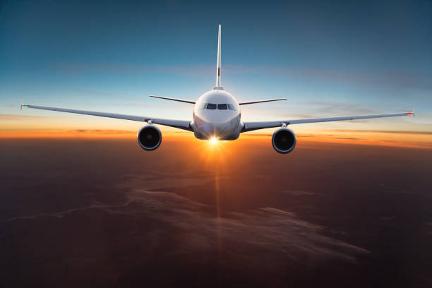 istock Commercial airplane flying above dramatic clouds. 1072472386