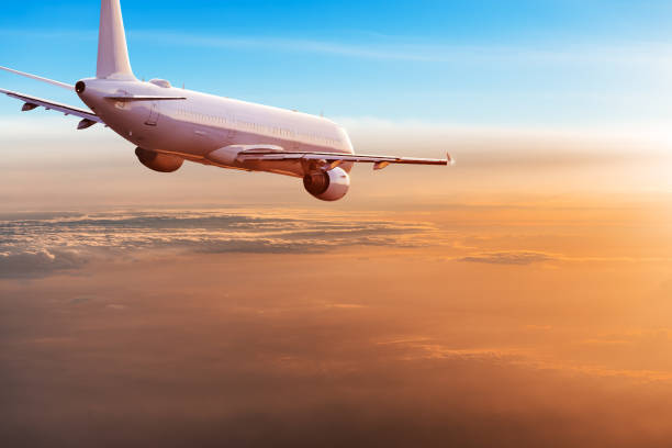 istock Commercial airplane flying above dramatic clouds. 1072472400