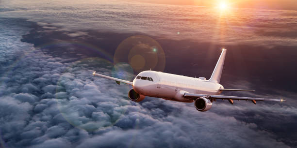 istock Commercial airplane flying above dramatic clouds. 1072472460