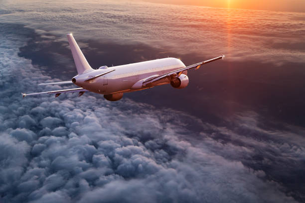 istock Commercial airplane flying above dramatic clouds. 1072472472