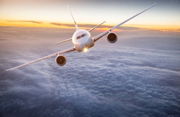 istock Commercial airplane flying above dramatic clouds. 1072472486