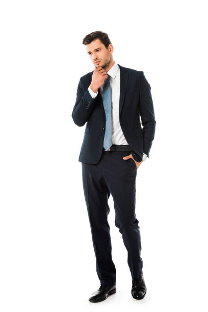 istock handsome thoughtful businessman in suit standing isolated on white 1072480802
