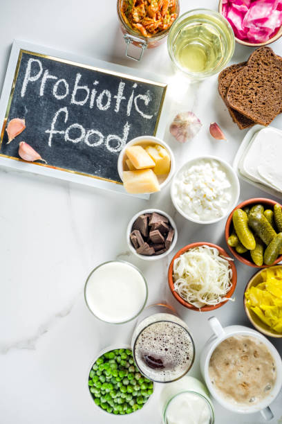 Super Healthy Probiotic Fermented Food Sources Super Healthy Probiotic Fermented Food Sources, drinks, ingredients, on white marble background copy space top view prebiotic probiotic stock pictures, royalty-free photos & images