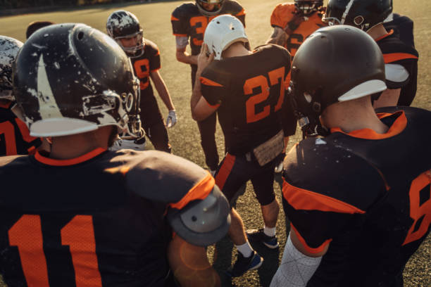istock American football team on time out 1072486896