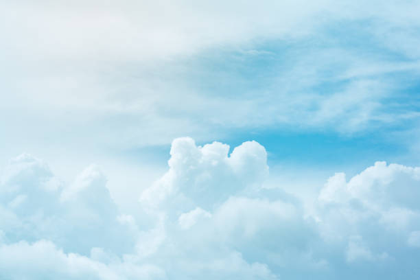 istock Soft cumulus fluffy clouds in  bright azure sky as background 1072486902