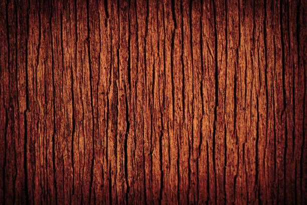 istock Old brown wooden cracked surface with vignette as background, texture 1072487026