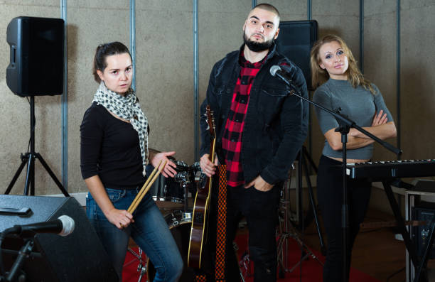 istock Cheerful guitarist, drummer and keyboardist 1072487478