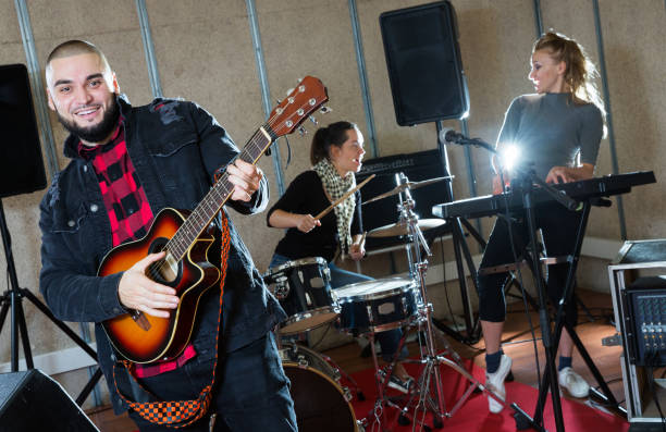 istock Emotional guy with guitar rehearsing 1072487520