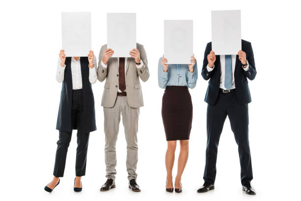 istock business team hiding behind empty boards isolated on white 1072490426