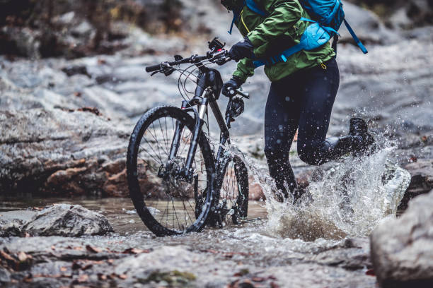 istock Crossing the river with bike 1072493822