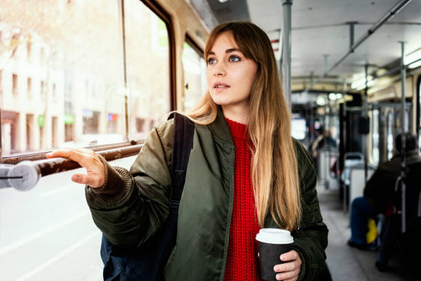 istock Young woman riding in public transportation 1072496462