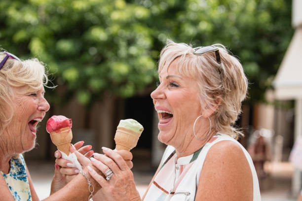 istock Mature Women Eating Ice Cream 1072496526