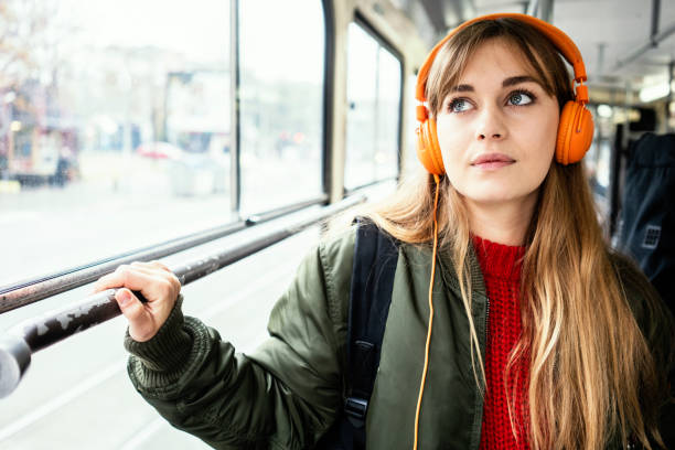 istock Young woman riding in public transportation 1072497068