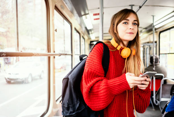 Young woman riding in public transportation