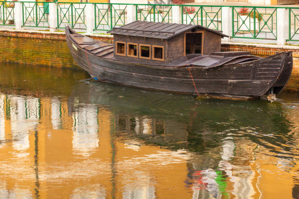 istock ancient house boat in the canal Milan 1072497196
